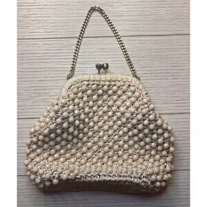 Vintage off white beaded bag w/ silver chain and kiss lock closure. Bag by Donna